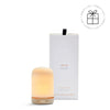 NEOM diffuser with packaging on a white background