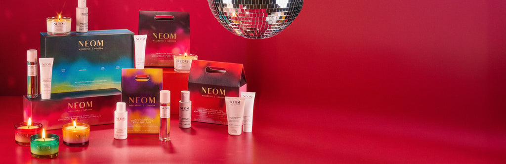 NEOM christmas gift sets on a red background