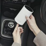NEOM Pod Mini+ in White with essential oil blend being used in the car